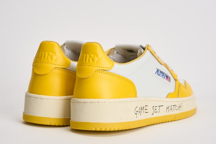 Sneakers uomo Medalist Low bianca e gialla AULM BH01 AUTRY 