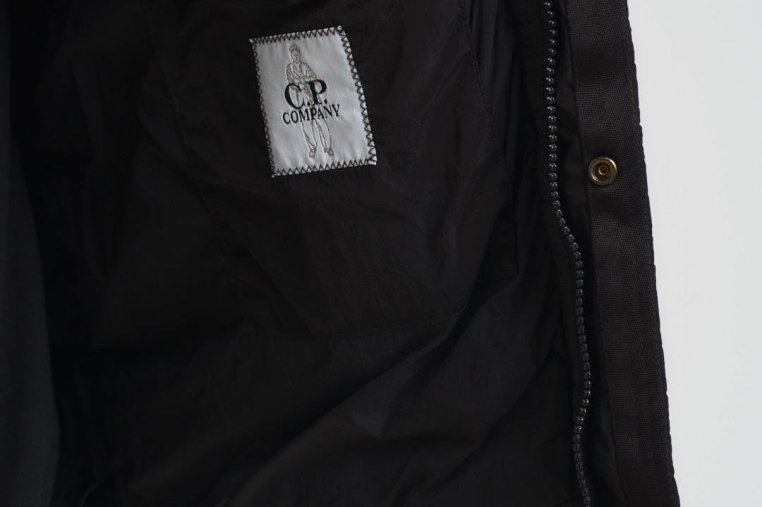Piumino uomo trapuntato nero 19CMOW012A 005904G999 C.P. COMPANY 