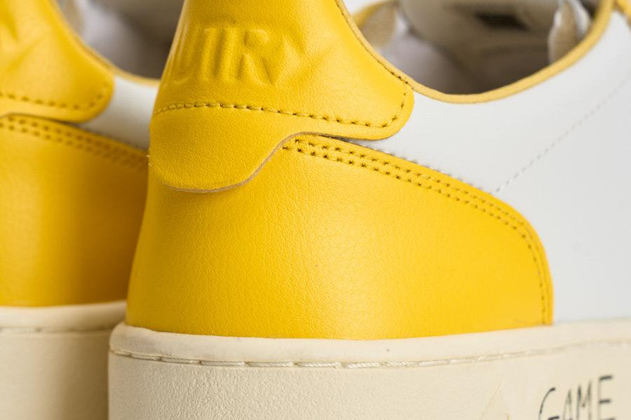 Sneakers uomo Medalist Low bianca e gialla AULM BH01 AUTRY 